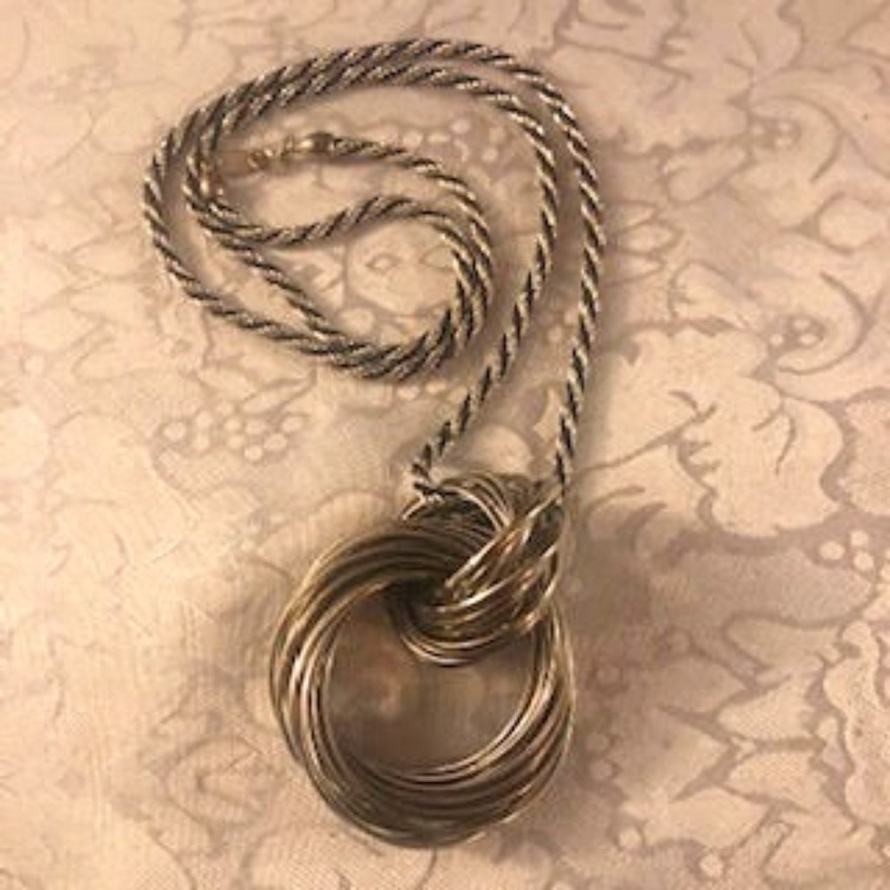 Circles, Slinky, Twirls are all in this Silvery Circle Necklace, loosely connect